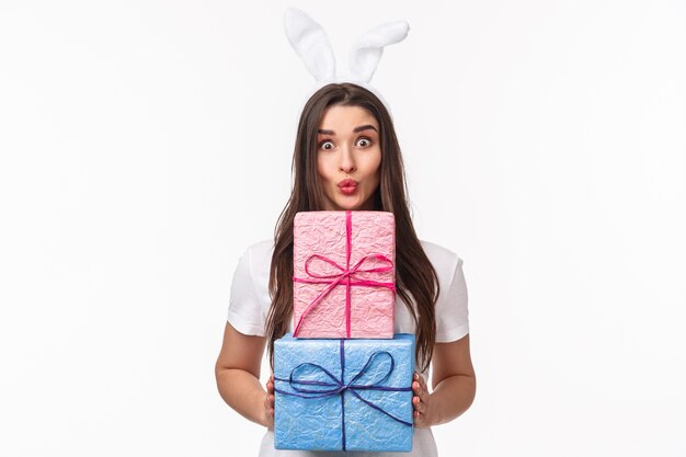 portrait expressive young woman holding gifts