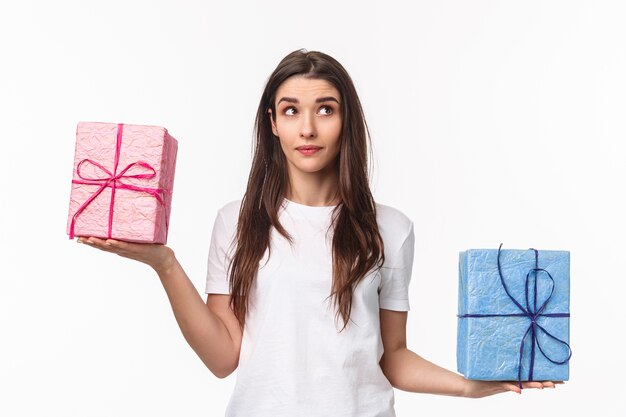 portrait expressive young woman holding gifts