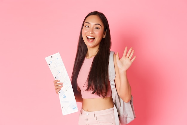 Portrait expressive young woman holding map