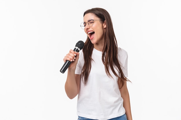 portrait expressive young woman singing