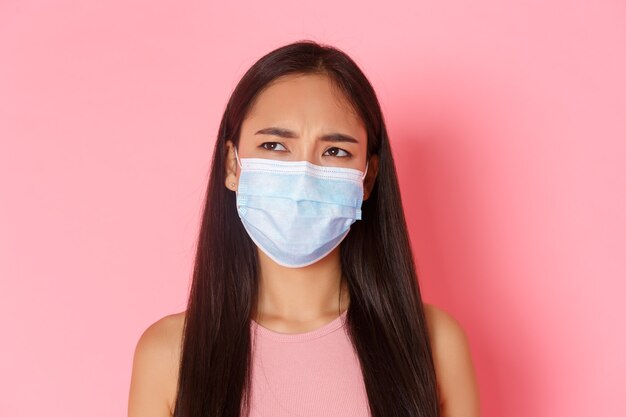 Portrait expressive young woman wearing mask