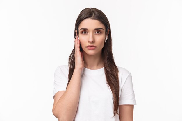 portrait expressive young woman with airpods