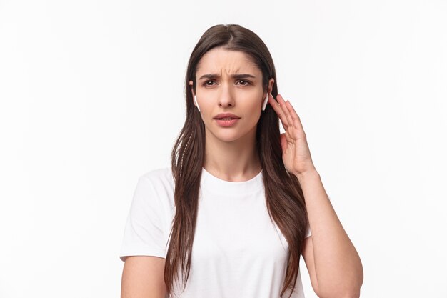 portrait expressive young woman with airpods