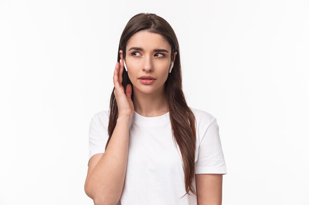 portrait expressive young woman with airpods