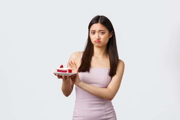 Portrait expressive young woman with cake