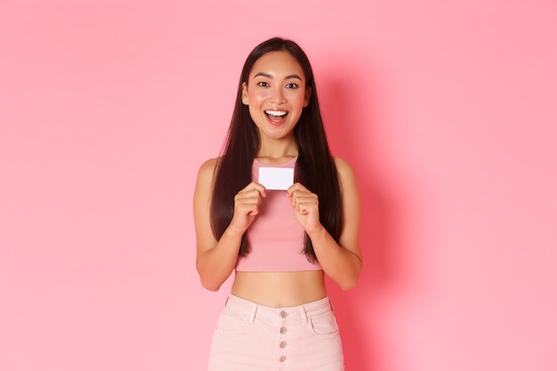 Portrait expressive young woman with credit card