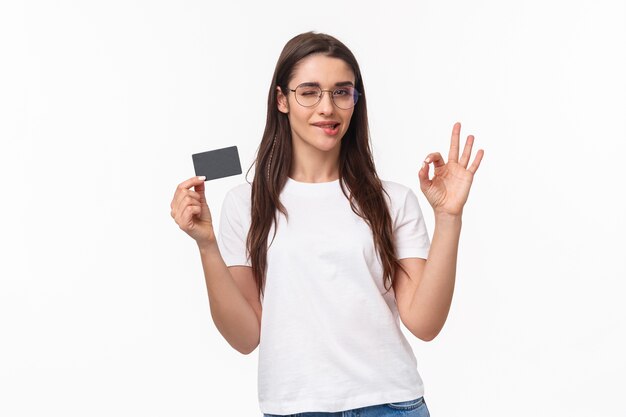 portrait expressive young woman with credit card