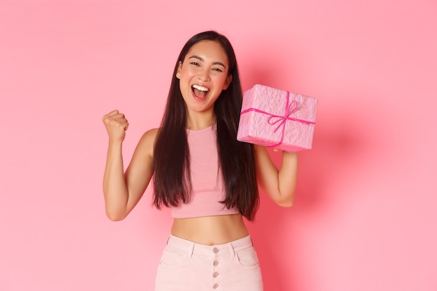 Portrait expressive young woman with gift box