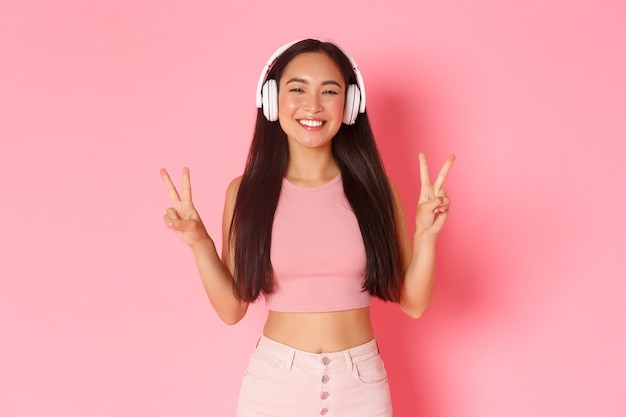 Portrait expressive young woman with headphones listening music