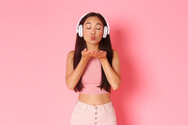 Portrait expressive young woman with headphones listening music