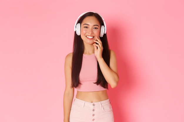 Portrait expressive young woman with headphones listening music
