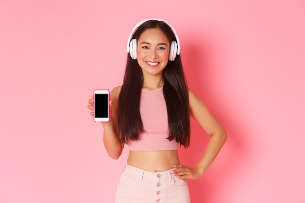 Portrait expressive young woman with headphones listening music