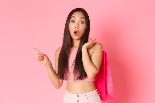 Portrait expressive young woman with shopping bags