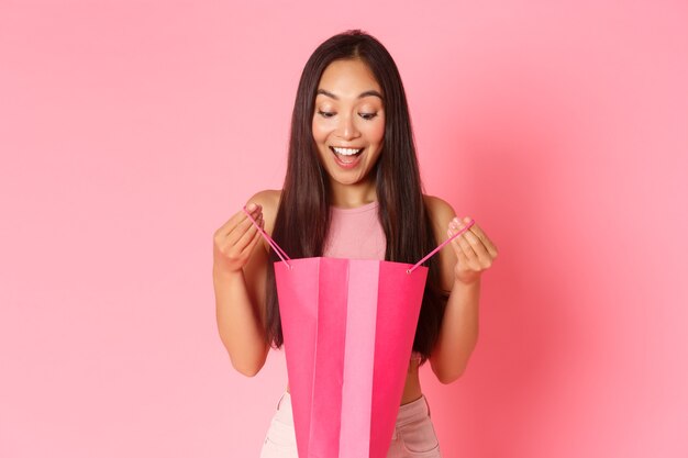 Portrait expressive young woman with shopping bags