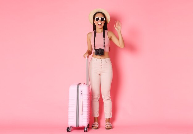 Portrait expressive young woman with suitcase