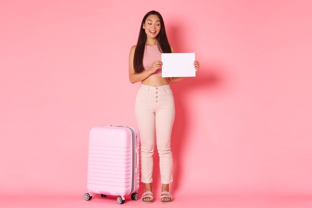 Portrait expressive young woman with suitcase