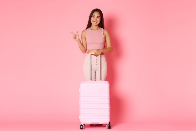 Portrait expressive young woman with suitcase