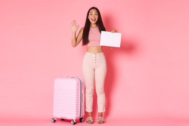 Portrait expressive young woman with suitcase