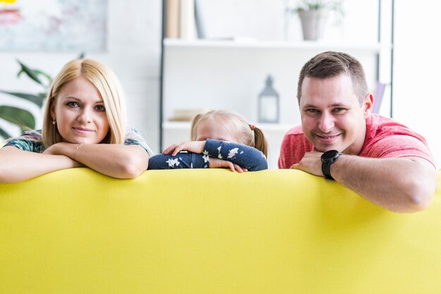 Portrait of a family sitting on sofa