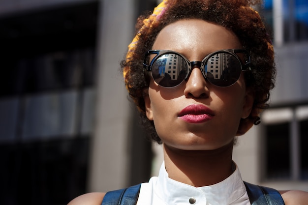 Portrait of fashion beautiful woman with bright makeup outside