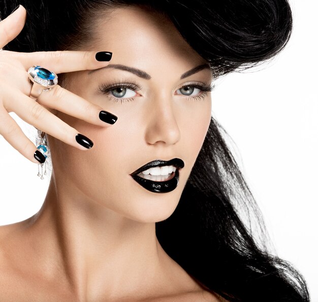 Portrait of fashion woman with black nails and lips in black color