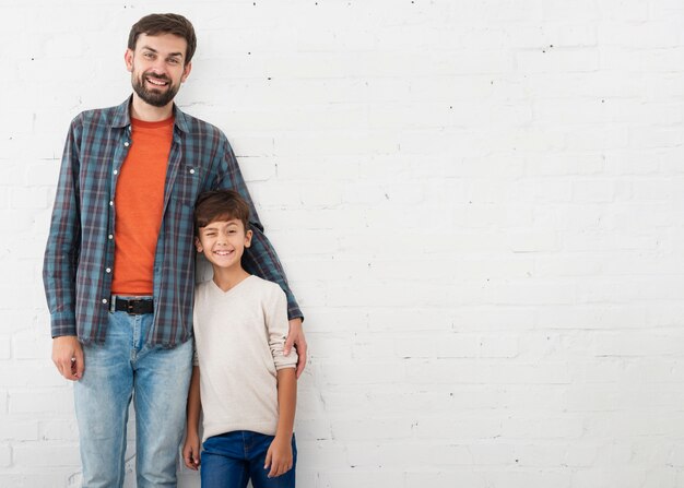 Portrait of father and son with copy space