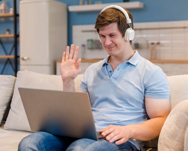 Portrait of father video conferencing at home