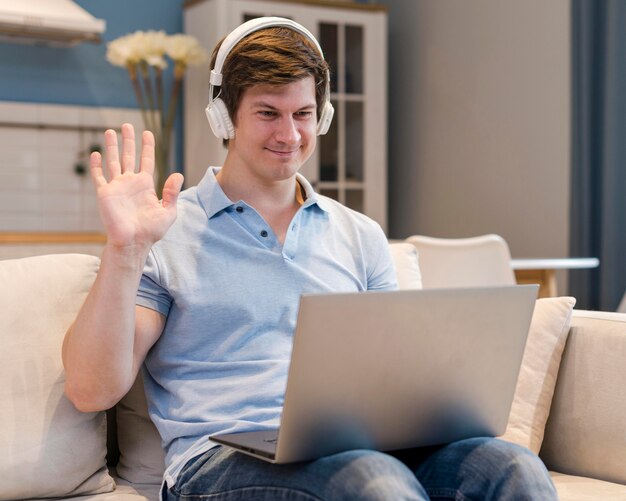 Portrait of father video conferencing at home