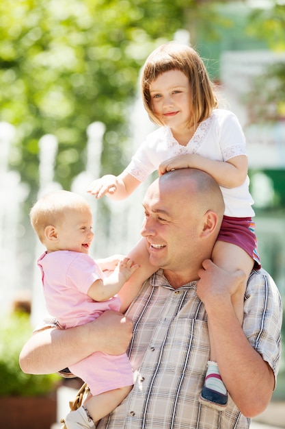 portrait of  father with two children