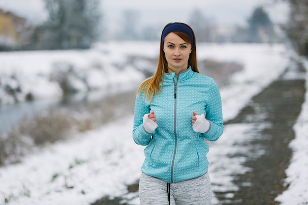 Portrait of female athlete in winter