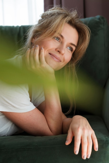 Free photo portrait of female and blurred plant