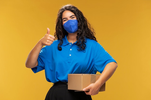 portrait of female deliverer showing thumbs up