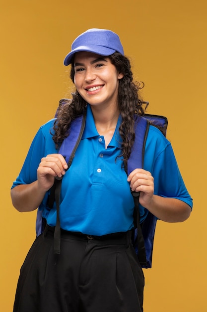 Portrait of female deliverer with backpack