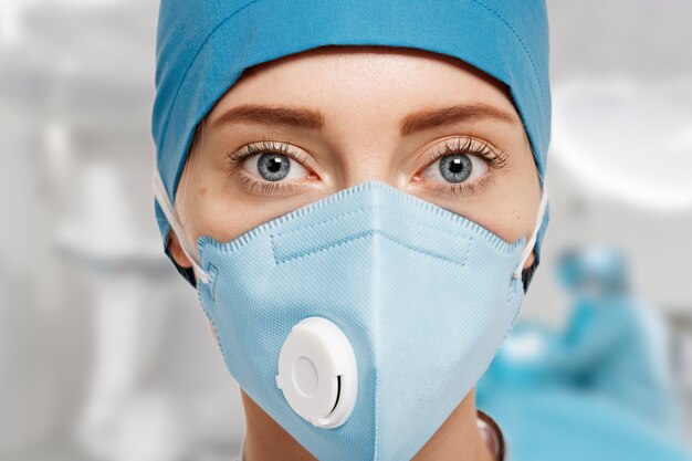 Portrait of female doctor wearing equipment