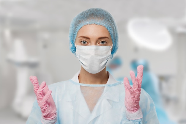 Portrait of female doctor wearing equipment