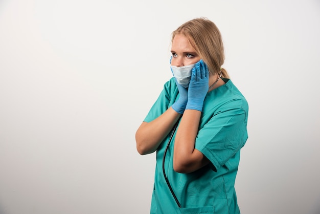 Portrait of female doctor wearing protective mask. 