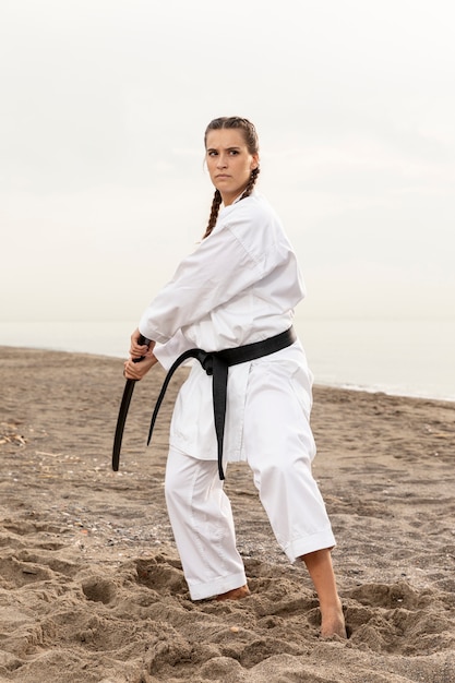 Portrait of female exercising karate