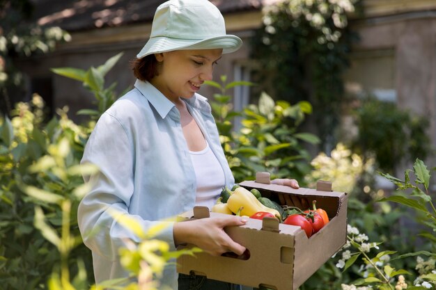 Portrait of female farmer working in her greenhouse