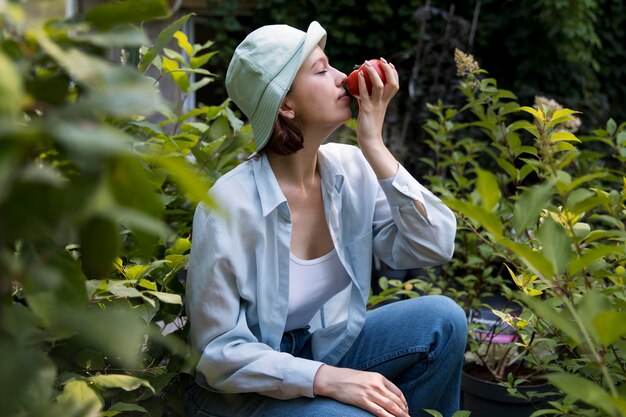 Portrait of female farmer working in her greenhouse