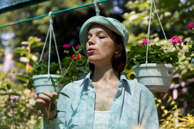 Portrait of female farmer working in her greenhouse