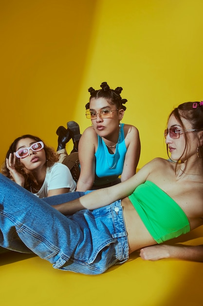 Portrait of female friends in 2000s fashion style posing together