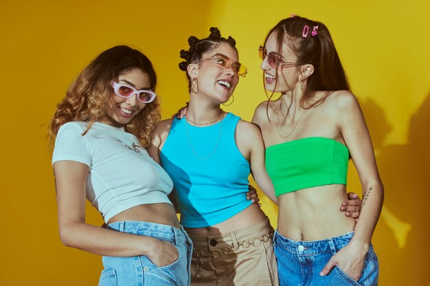 Portrait of female friends in 2000s fashion style posing together