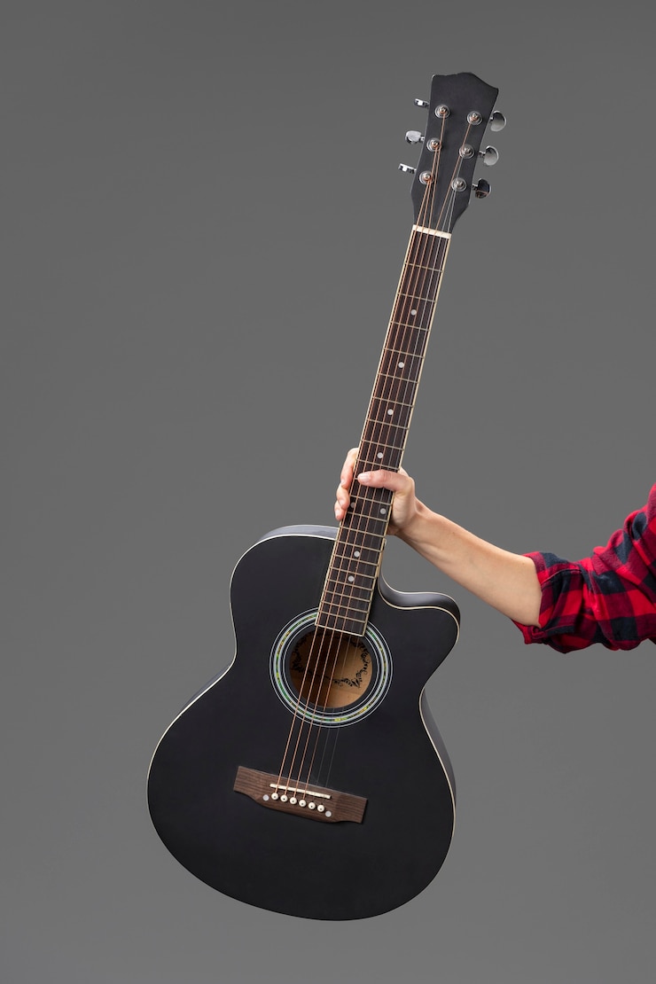 Free Photo portrait female guitarist