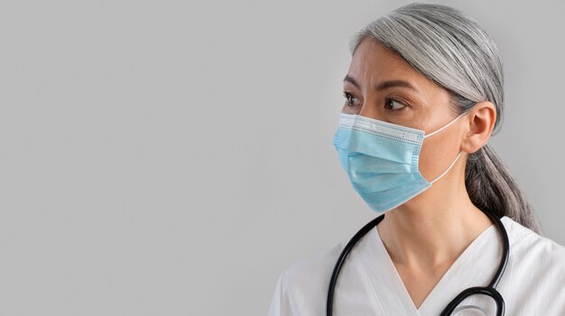 Portrait of female health worker with copy space