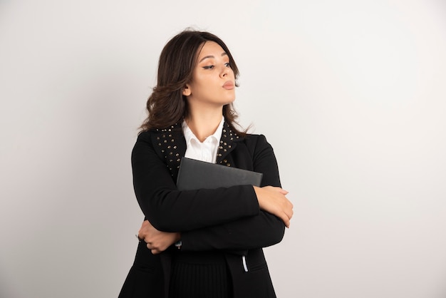 Portrait of female teacher posing on white.