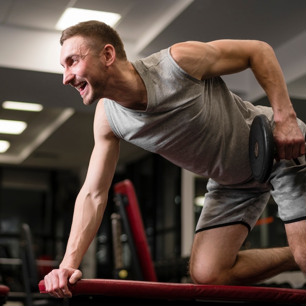 Free photo portrait of fit man doing exercises