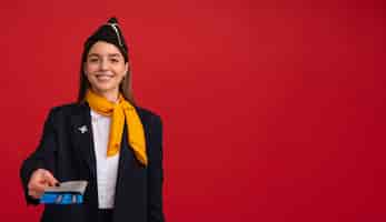 Free photo portrait of flight attendant with plane tickets and passport