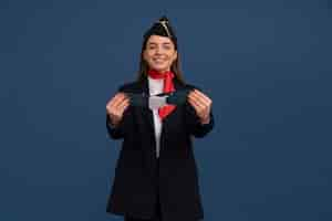 Free photo portrait of flight attendant with safety belt