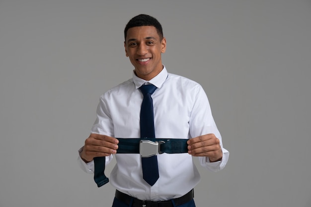 Portrait of flight attendant with safety belt