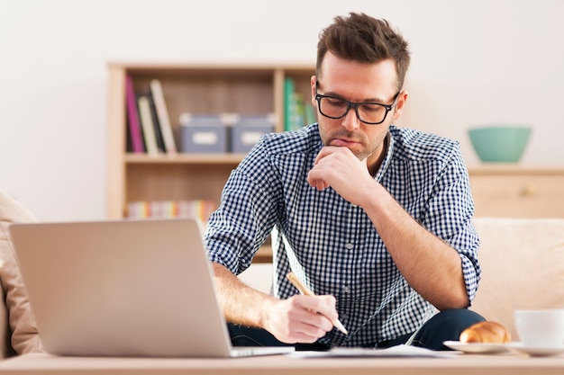 Portrait of focus man working at home